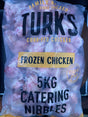 Package of frozen chicken nibbles with 'Turk's' branding on a clear background